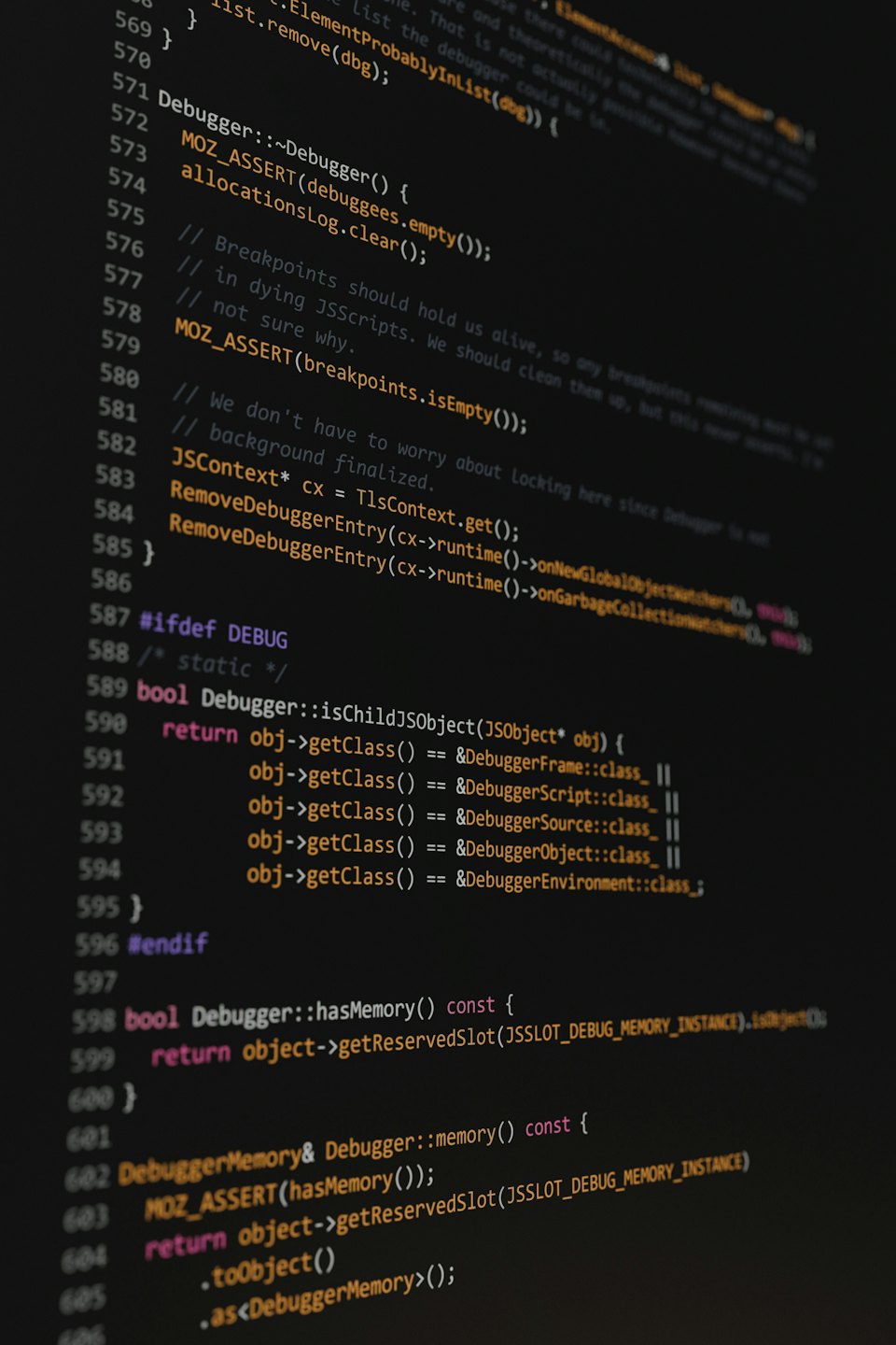 Multi-colored programming code displayed on a dark screen.